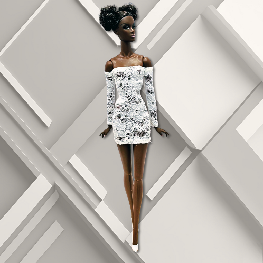 12" African- American supermodel fashion doll wearing a white lace sheath mini dress.