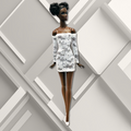12" African- American supermodel fashion doll wearing a white lace sheath mini dress.