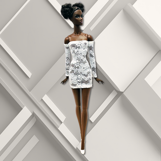 12" African- American supermodel fashion doll wearing a white lace sheath mini dress.
