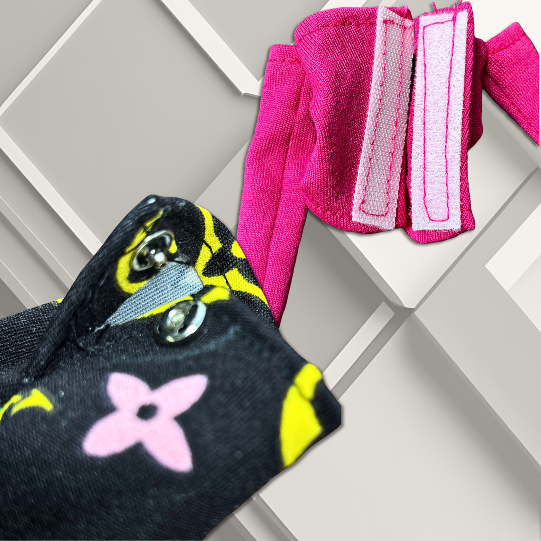 Casual outfit for 11.5" standard Barbie fashion doll with a patterned tote bag, pink top featuring hook- and- loop (Velcro) closure, and black, wide- leg pants with a designer- inspired print, featuring a snap closure, on a geometric background.